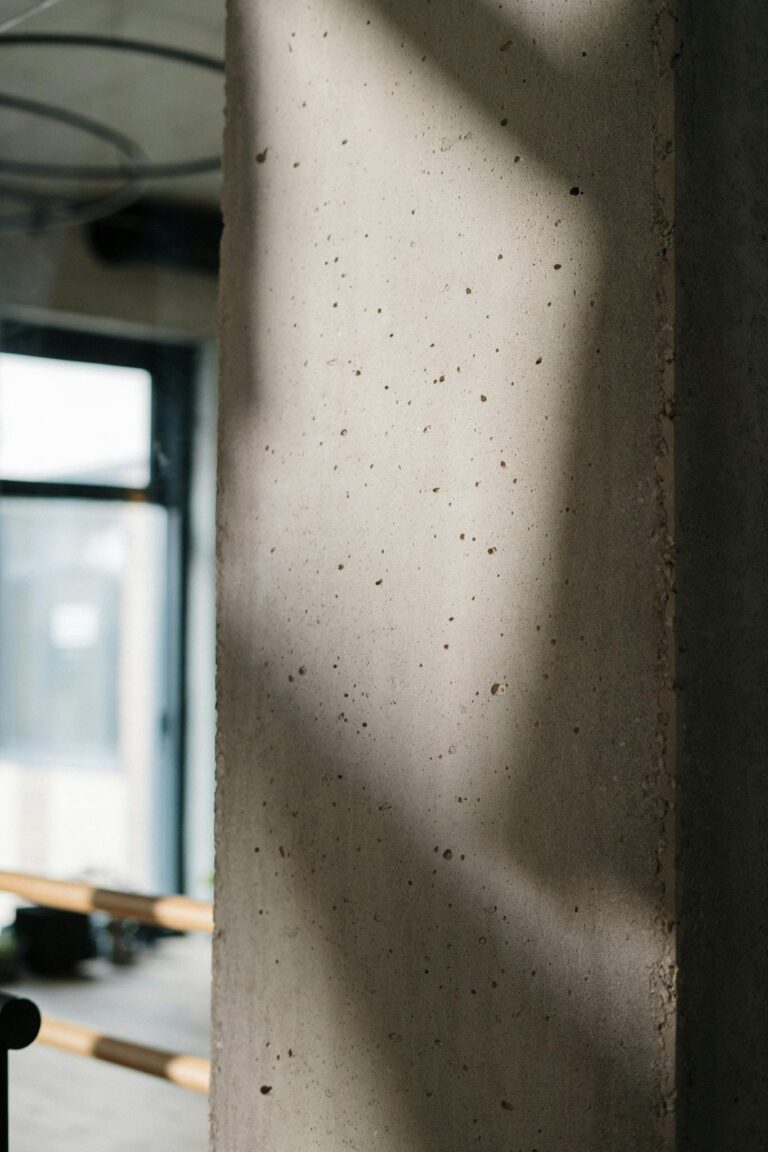 Concrete interior detail with soft shadows and natural lighting.